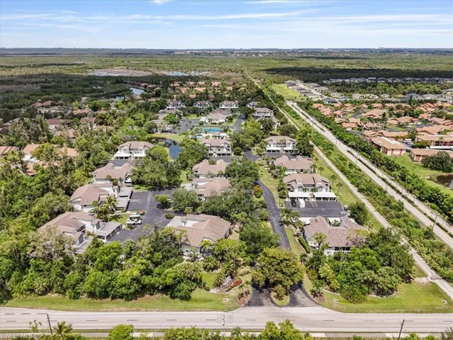 Aerial perspective of suburban area with a nearby body of water