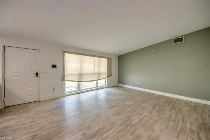 Unfurnished living room with light wood-type flooring