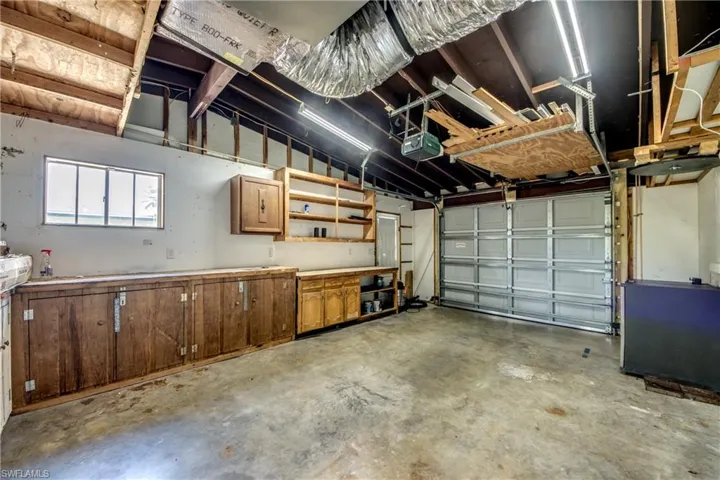 Garage featuring a garage door opener