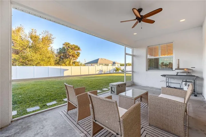 View of patio featuring ceiling fan and an outdoor hangout area
