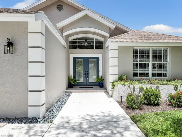 Doorway to property featuring french doors