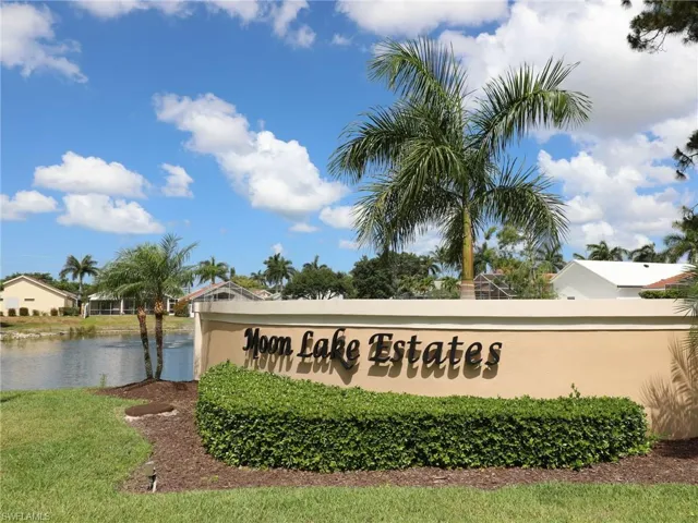 Community sign featuring a water view