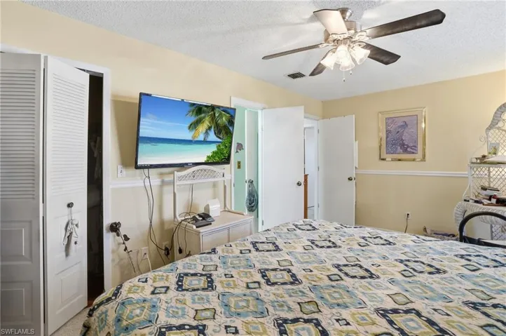 Primary Bedroom, a ceiling fan and closet