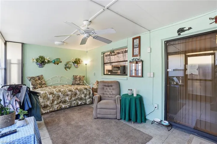 Enclosed Lanai/sunroom, light tile floors and ceiling fan