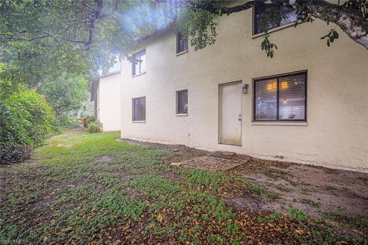 Back entry opens to kitchen and dining area.