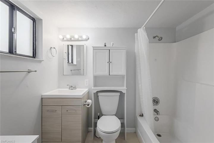 En suite primary bathroom with a shower and tub combo.