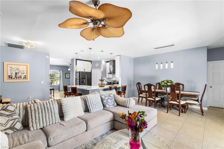 Open-concept living space featuring ceramic tile flooring and recessed lighting