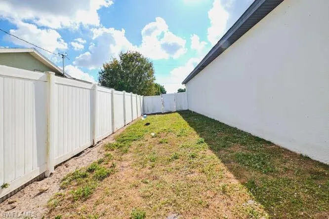 View of fenced backyard