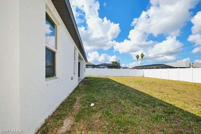 View of fenced backyard