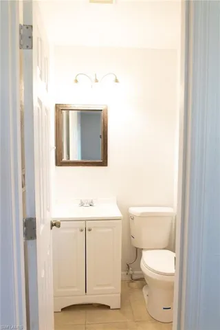 Bathroom featuring vanity and light tile patterned floors