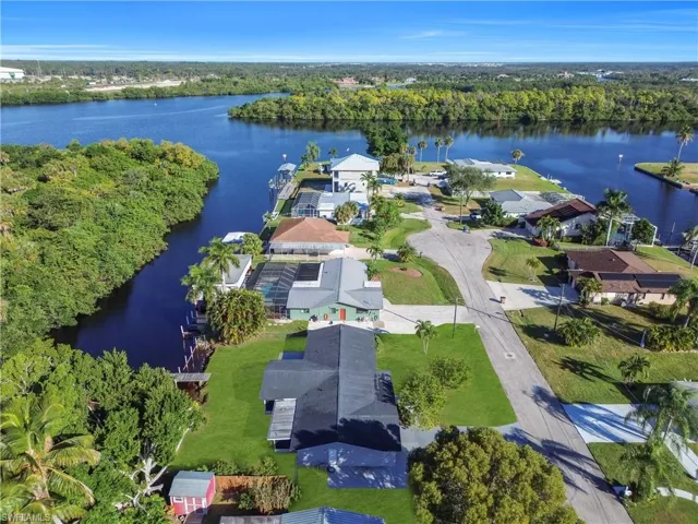 Aerial perspective of suburban area with a large body of water