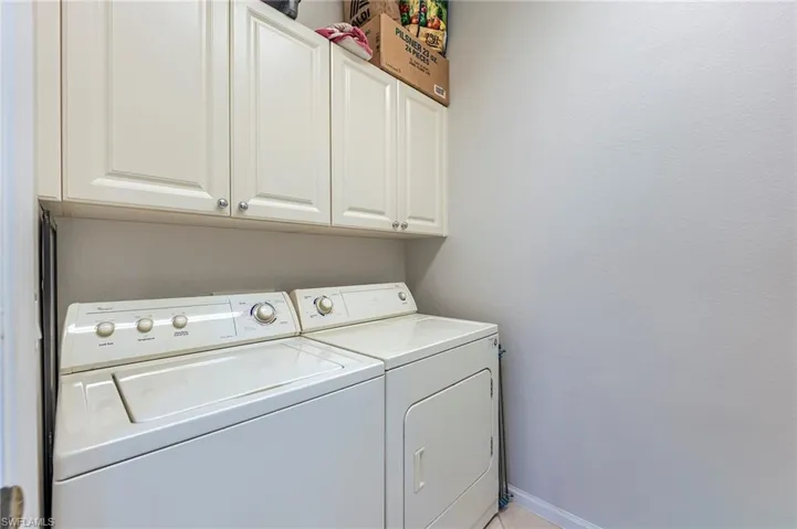 Laundry room next to guest bath