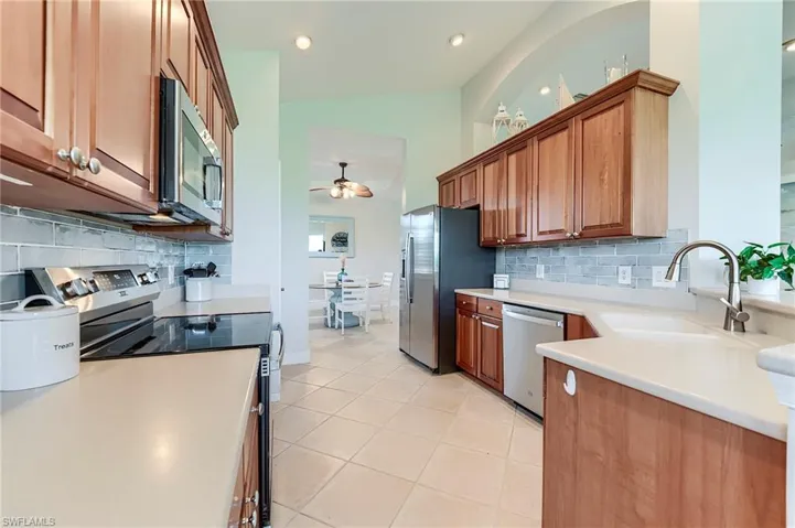 Stainless appliances and wood cabinitry