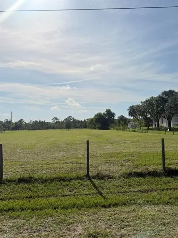 View of yard with a rural view