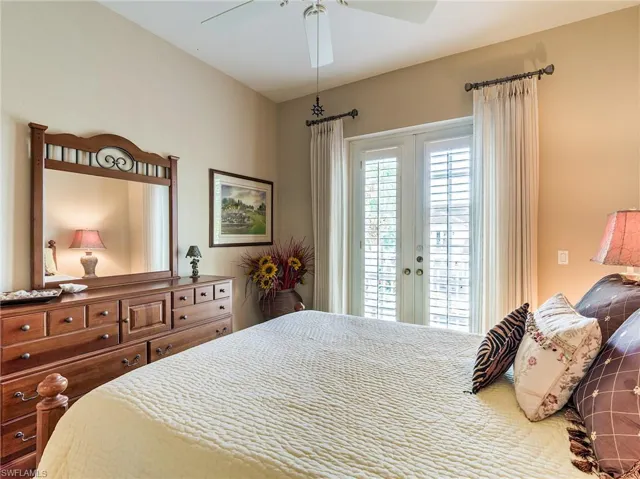 Bedroom featuring ceiling fan, french doors, and access to outside