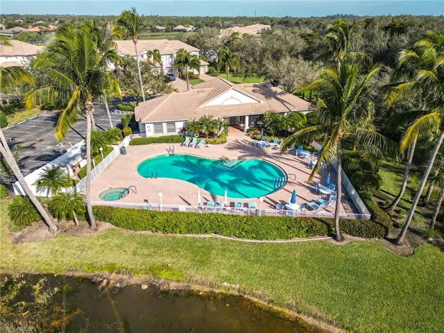 View of pool with a patio and a yard