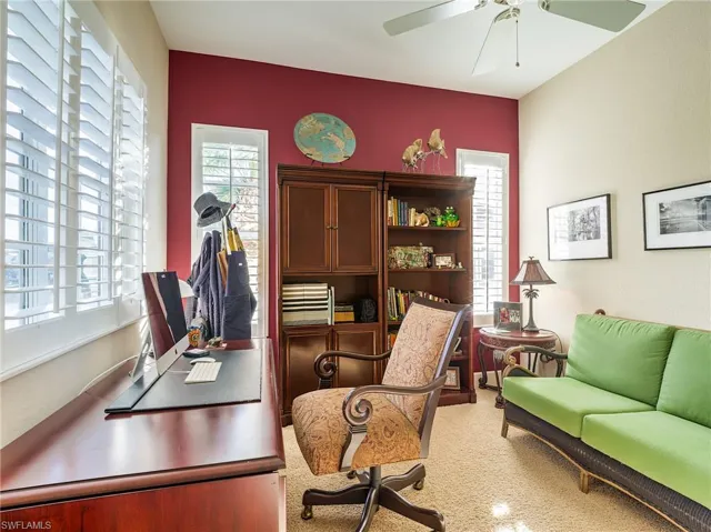 Office area featuring carpet and ceiling fan