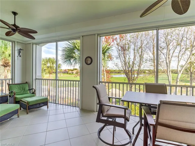 Sunroom / solarium featuring a wealth of natural light and ceiling fan