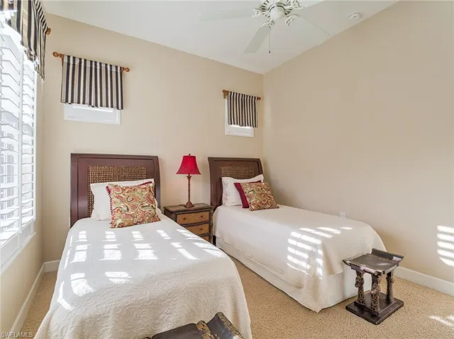 Bedroom with carpet floors and ceiling fan