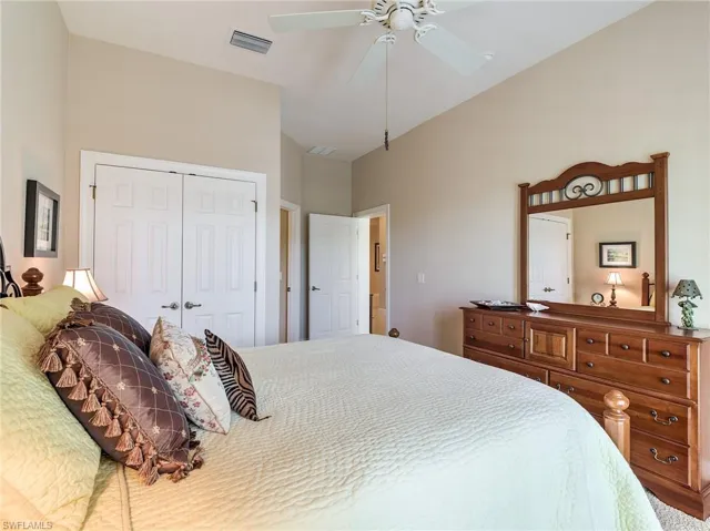 Bedroom featuring ceiling fan and a closet