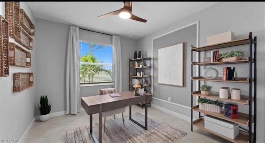 Office featuring baseboards and ceiling fan
