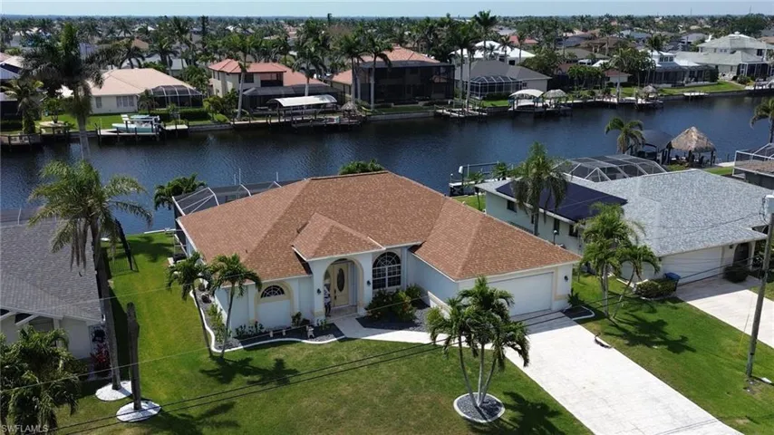 Bird's eye view with a water view and a residential view