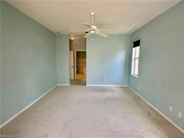 Master Bedroom featuring a ceiling fan, baseboards, and carpet floors