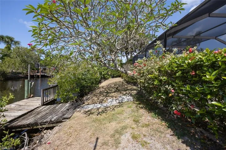 Rear of home on wide navigable canal, sought-after Southern exposure!