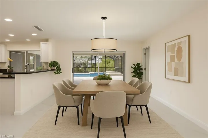 Dining room also has room for bar stools! (virtually staged)