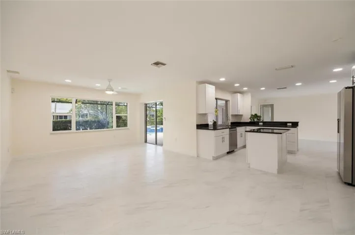 Kitchen open to family and dining rooms and lanai