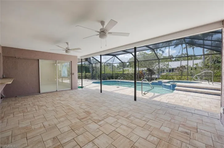 You'll enjoy the huge tiled covered portion of lanai! Note home exterior is now painted white