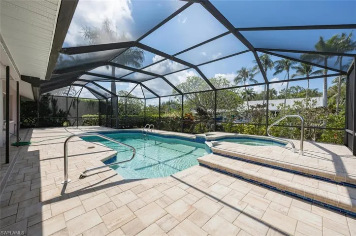 You'll love watching wildlife and tropical birds from the new pool/spa with huge tiled screened lanai overlooking canal!