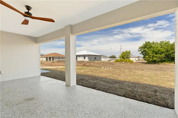 View of patio featuring ceiling fan