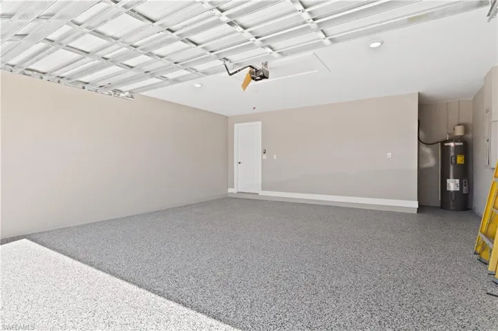 Garage featuring electric water heater
