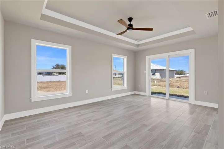 Empty room featuring wood tiled floors and ceiling fan