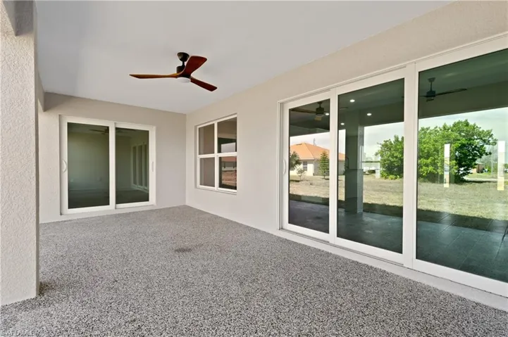 View of patio featuring ceiling fan