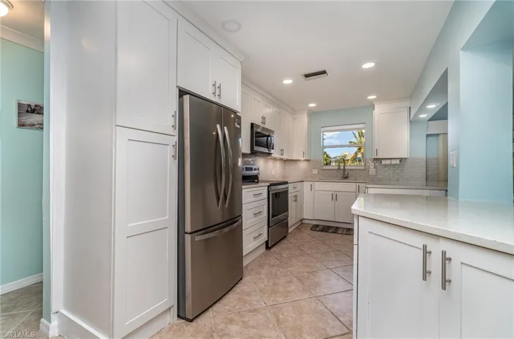 Kitchen opens into Living Room & Dining Areas!