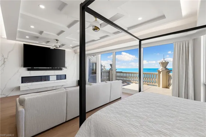 Bedroom with coffered ceiling, recessed lighting, access to outside, and light wood-style flooring