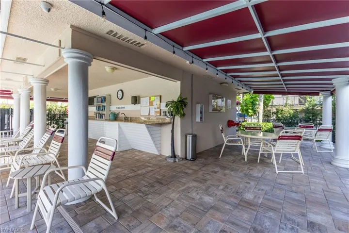 View of patio with outdoor dining area