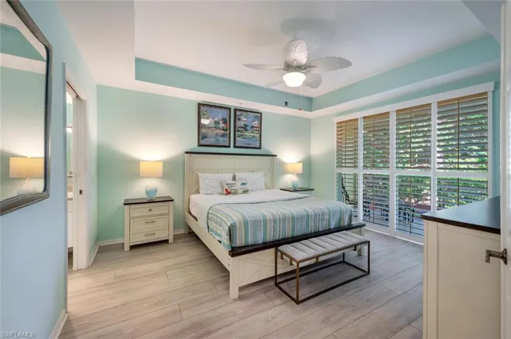 primary bedroom with sliders to outside patio