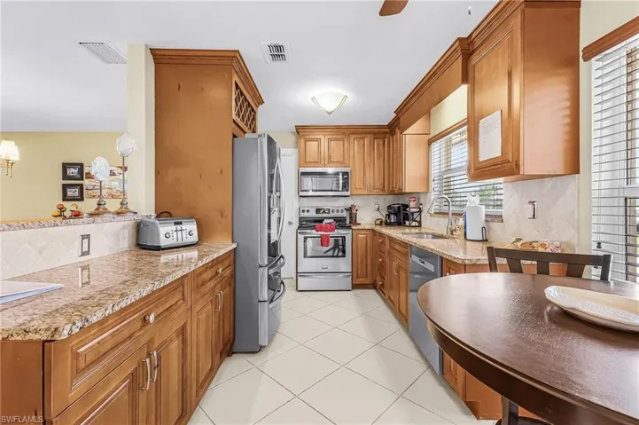 Beautiful remodeled kitchen with pass thru to the dining area