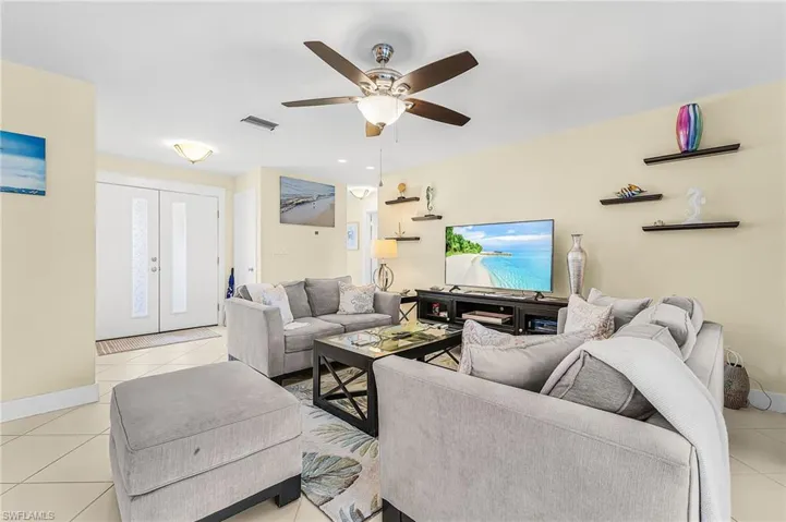 Spacious great room open to kitchen and patio and pool