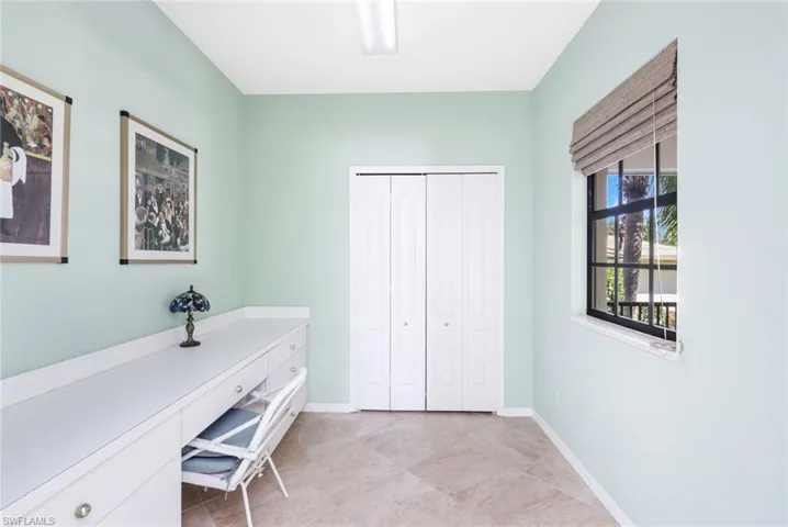 Private Office loacated just inside the Front Door to the Right- Tiled, Built In Desk Area/Storage