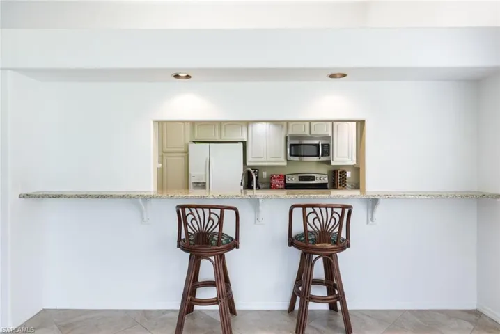 View into the Kitchen- Counter Bar Stools Stay