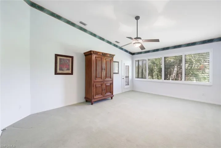 Owner's Primary Suite Located in the Rear of the Home, Private Door to the Lanai- Newer Carpet