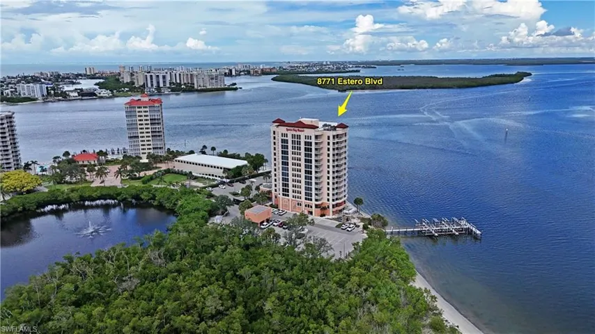Multi-story residential building with private boat docks and waterfront access
