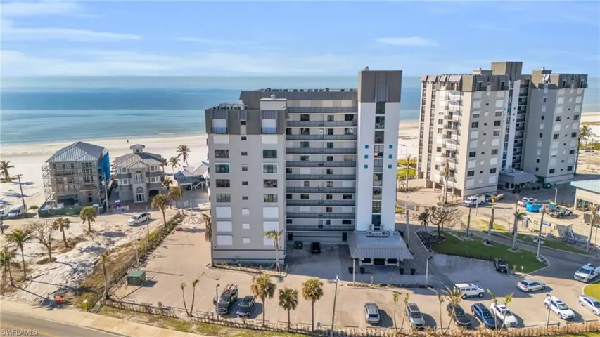 Drone / aerial view with a view of the beach and a water view virtually enhanced image
