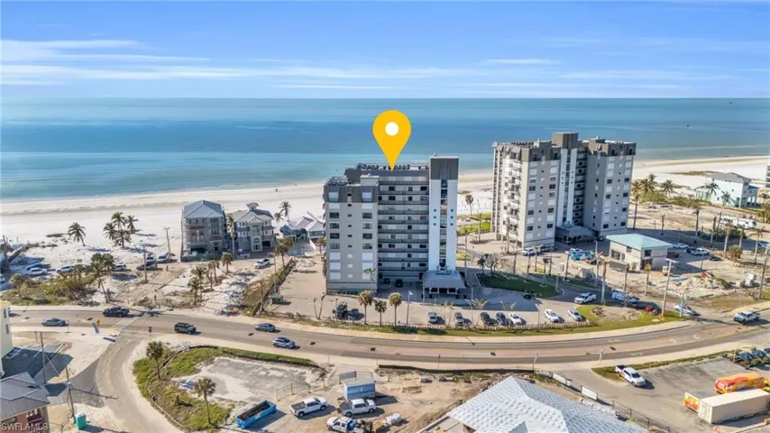 Birds eye view of property featuring a view of the beach and a water view virtually enhanced image