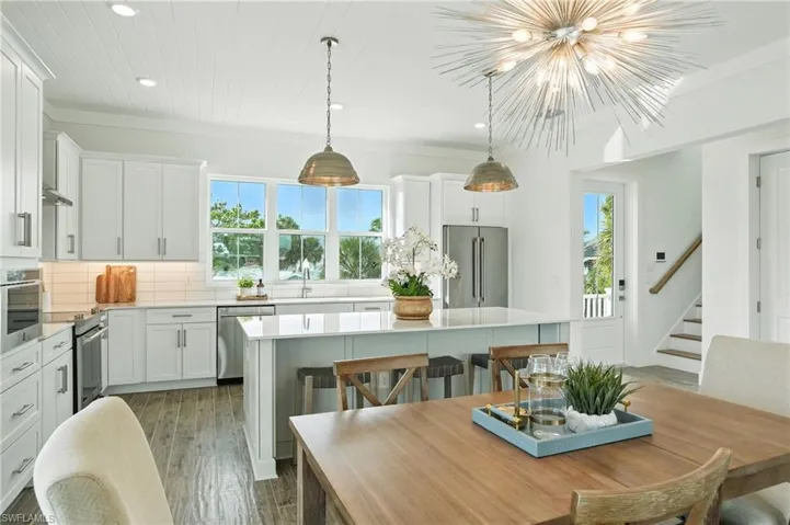 Open concept dining/kitchen Image virtually enhanced