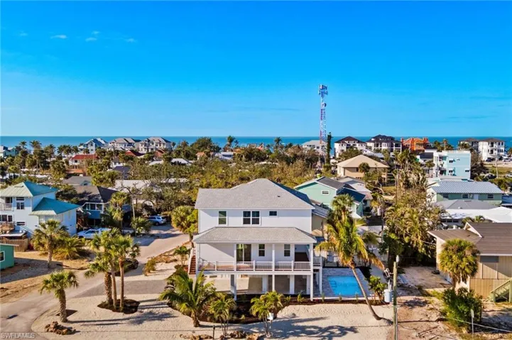 Gorgeous Elevated Pool Home -Drone / aerial view with a residential view and a water view  - Virtually Edited Image
